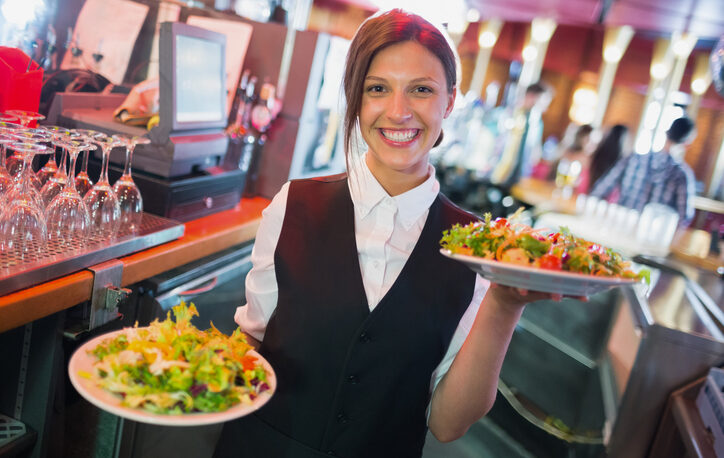 Food handler serving food